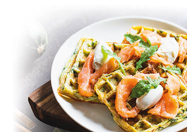 Belgian waffles with zucchini and greens with cottage cheese and salted salmon.
