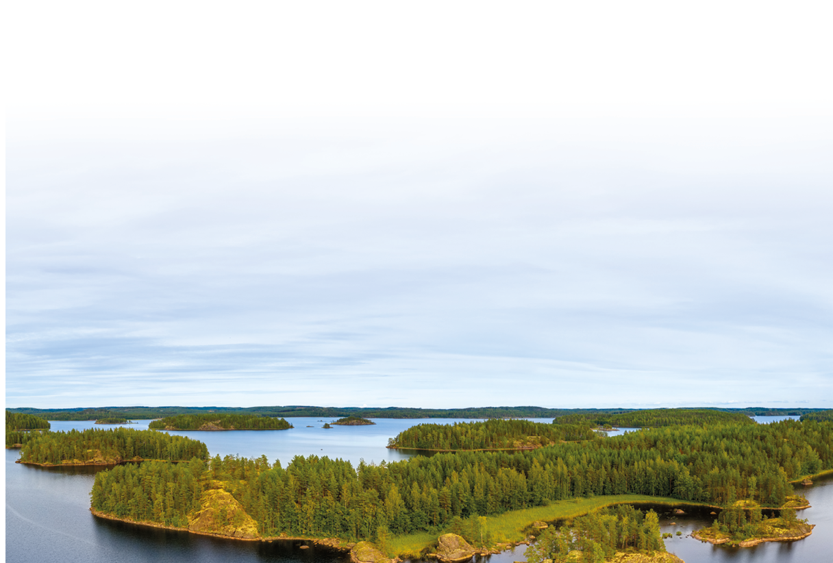 Aerial view of of small islands on a blue lake Saimaa. Landscape with drone. Blue lakes, islands and green forests from above on a cloudy summer morning. Lake landscape in Finland