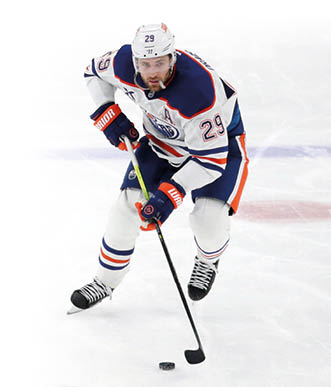 Jan 9, 2025; Pittsburgh, Pennsylvania, USA; Edmonton Oilers center Leon Draisaitl (29) skates up ice with the puck against the Pittsburgh Penguins during the third period at PPG Paints Arena. Mandatory Credit: Charles LeClaire-Imagn Images