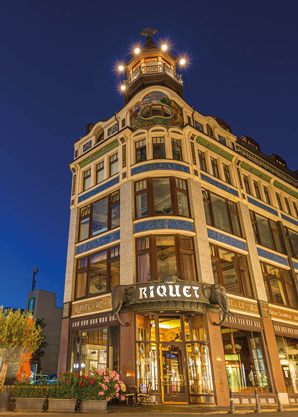 Leipzig, Germany - July 02, 2022: City Center of the saxony metropolis at night. Kaffeehaus Riquet Caf at the „Reichsstrasse“. Two elephant statues line the front door. One of the last coffee house
