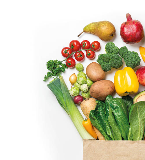 Healthy food background. Healthy food in paper bag vegetables and fruits on white. Food delivery, shopping food supermarket concept