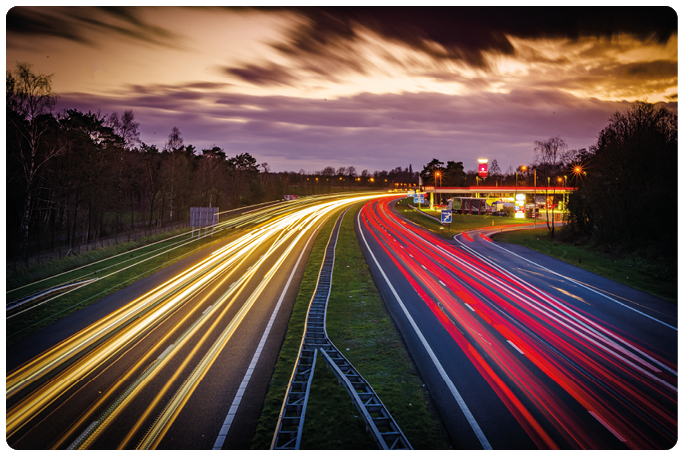 OLDENZAAL, NETHERLANDS - MARCH 24, 2023: Long exposure shot of traffic on the E30 highway from Amsterdam to Berlin.