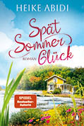 Das Buchcover zeigt den Titel „Sp t Sommer Gl ck“ von Heike Abidi mit einem gelben Haus am See vor bewaldetem Hintergrund und einem blauen Himmel. Beschreibung von KI generiert